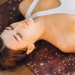 Aromatherapy - Woman Relaxing in Yoga Mat