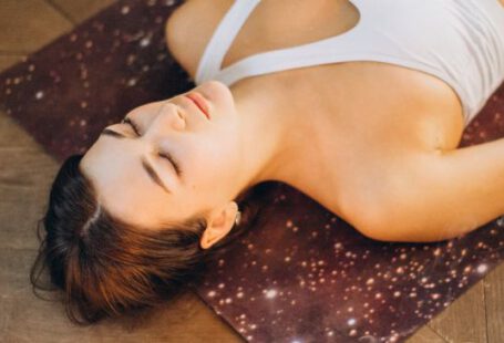 Aromatherapy - Woman Relaxing in Yoga Mat